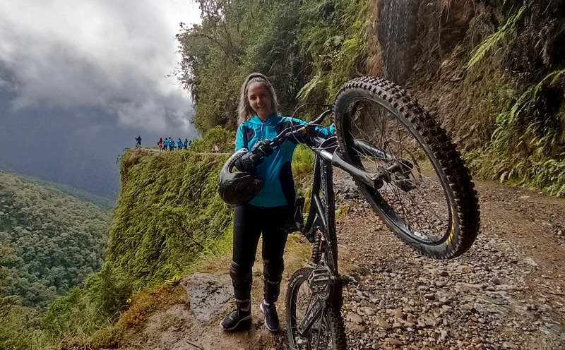 Beautiful girl riding down the Death Road Bolivia